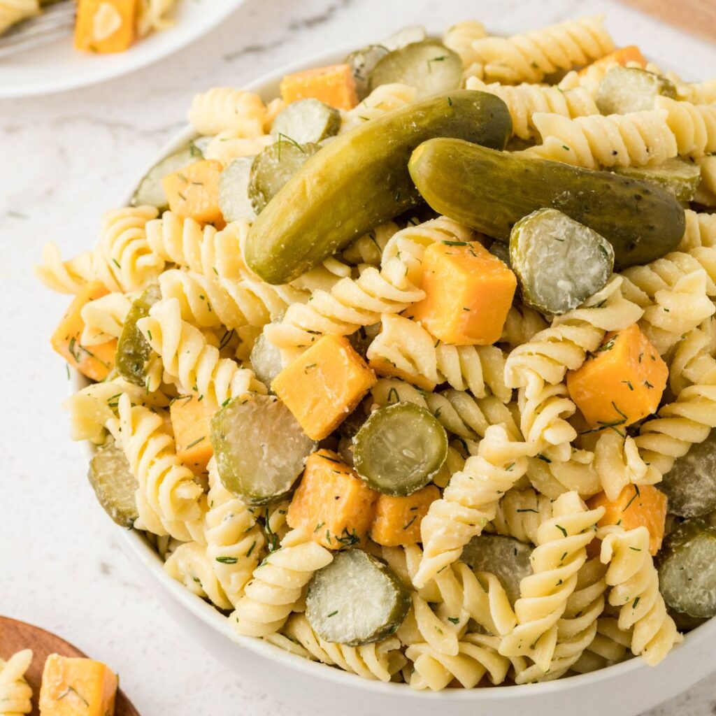 A bowl of pasta salad in creamy sauce