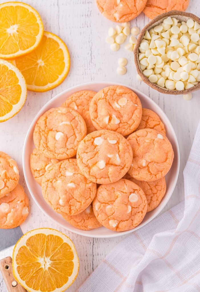 Overhead shot of this recipe on a white plate with halved oranges next to it. 