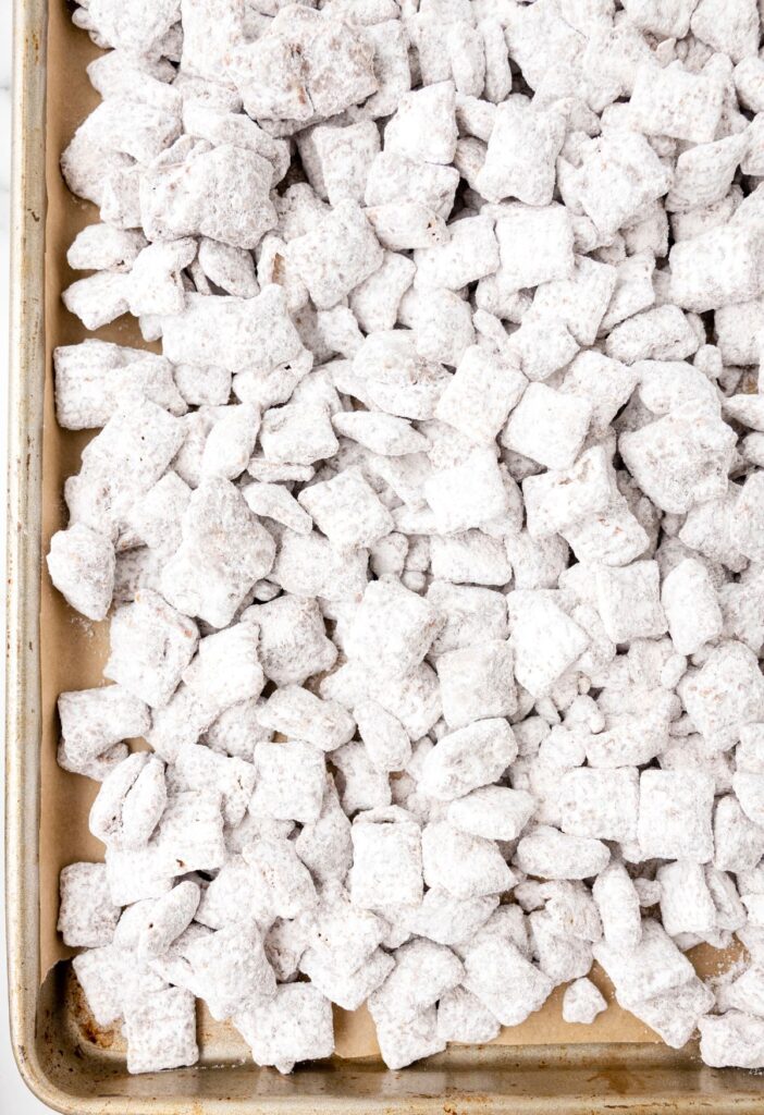 Chex mix, puppy chow, on a cookie sheet. 