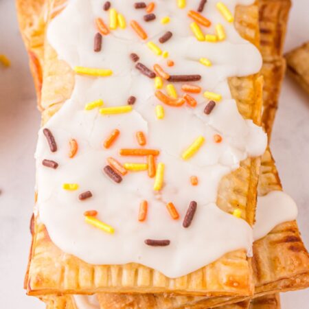 A stack of pop tarts with sprinkles.