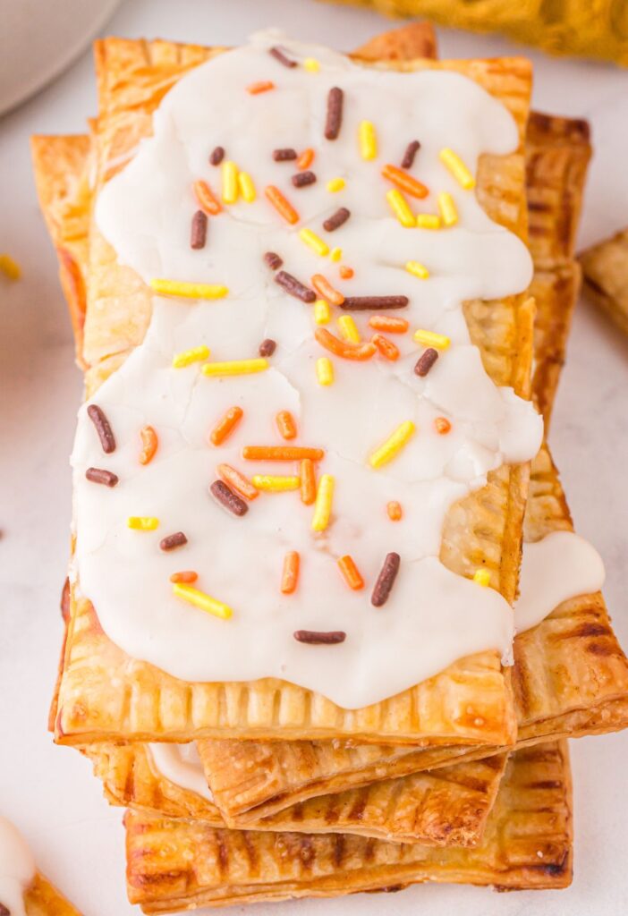 A stack of pop tarts with sprinkles. 