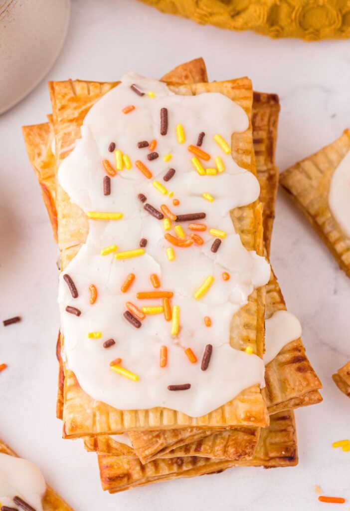 Stack of pop tarts with a glaze and a sprinkles
