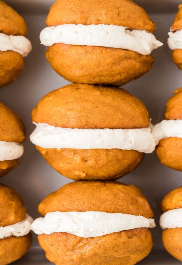 Whoopie pies laying sideways inside a dish. 