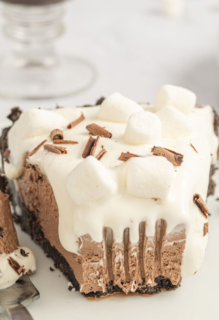 Slice of hot cocoa pie with a fork bite taken out of the front.